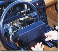 Removing the airbag module from the steering wheel.