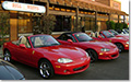 Miatas in front the of Boll Weevil restaurant.