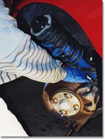 Reinstalling the shock assembly.