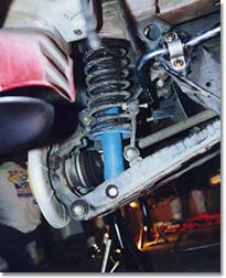 Removing the rear shock assembly.